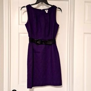 Fitted dress with a pencil skirt. It's a beautiful purple color and cotton blend